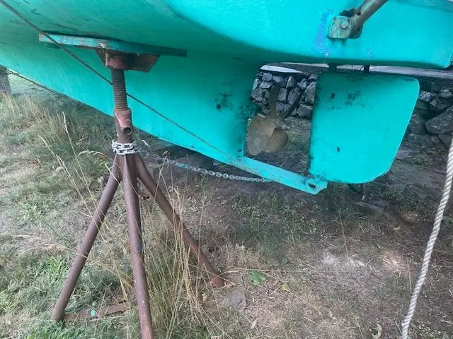 Slide: The Image of 1981 SISU 26 boat hull on stands, showing propeller and rudder. - 3