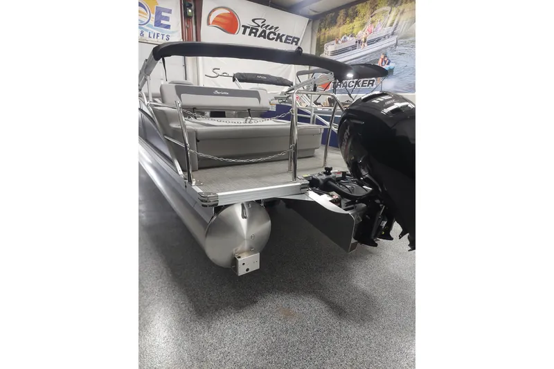 Slide: The Image of 2025 Barletta ARIA 22UC pontoon boat with outboard motor in showroom. - 13