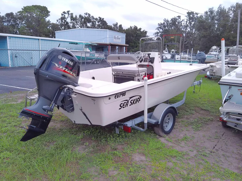 Slide: The Image of 2024 Carolina Skiff EV198 boat with Yamaha outboard motor on trailer. - 3