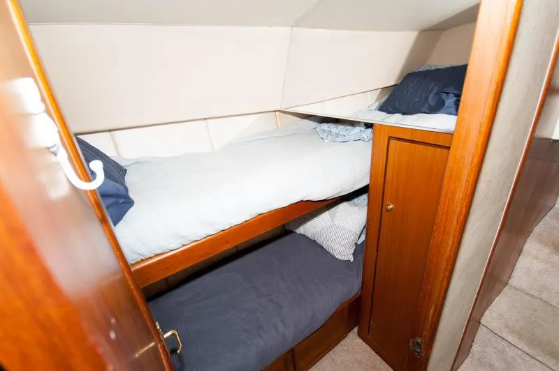 Slide: The Image of Bunk beds in 1997 Ocean Yachts 53 Super Sport cabin with wooden cabinetry. - 11