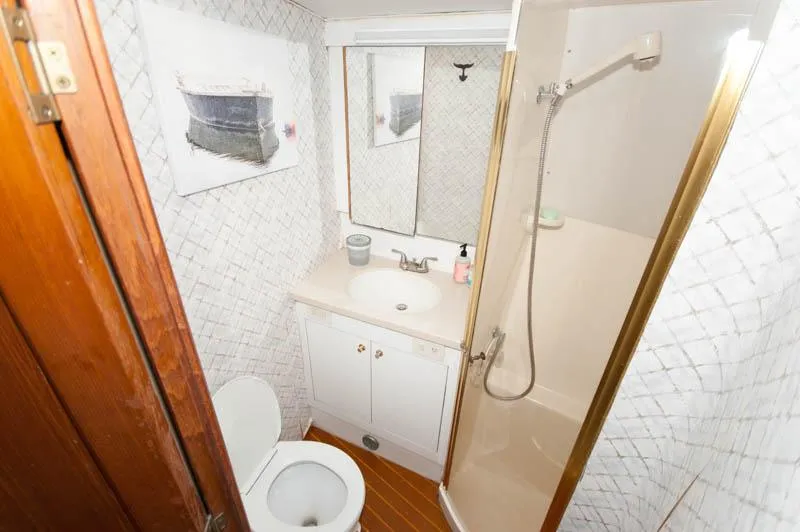 Slide: The Image of Bathroom interior of 1997 Ocean Yachts 53 Super Sport with shower and vanity. - 13