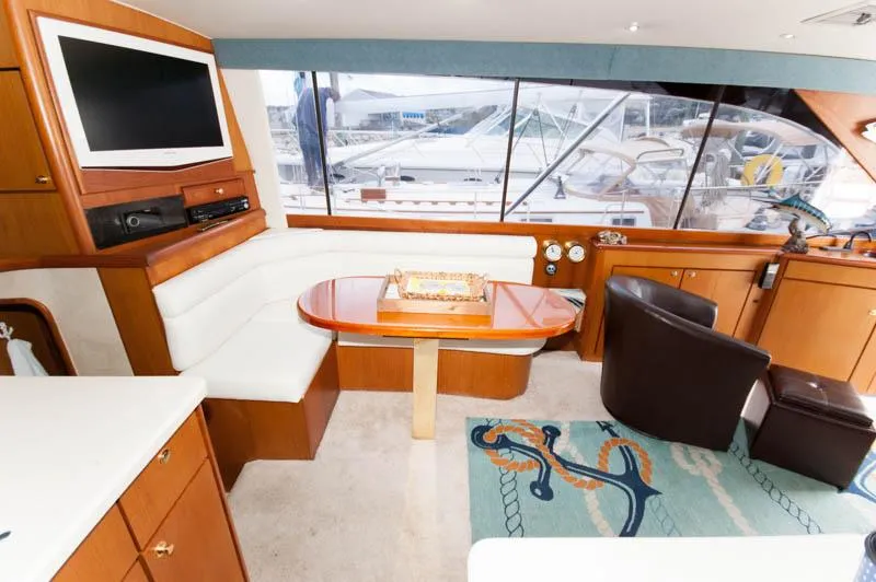 Slide: The Image of Interior of a 1997 Ocean Yachts 53 Super Sport with seating and entertainment area. - 16