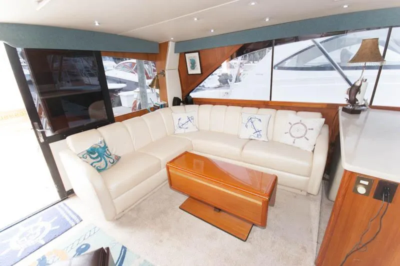 Slide: The Image of Luxurious interior of a 1997 Ocean Yachts 53 Super Sport with white leather seating. - 18