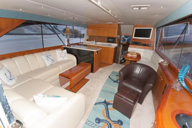 Slide: The Image of Luxurious interior of a 1997 Ocean Yachts 53 Super Sport with elegant seating and nautical decor. - 19
