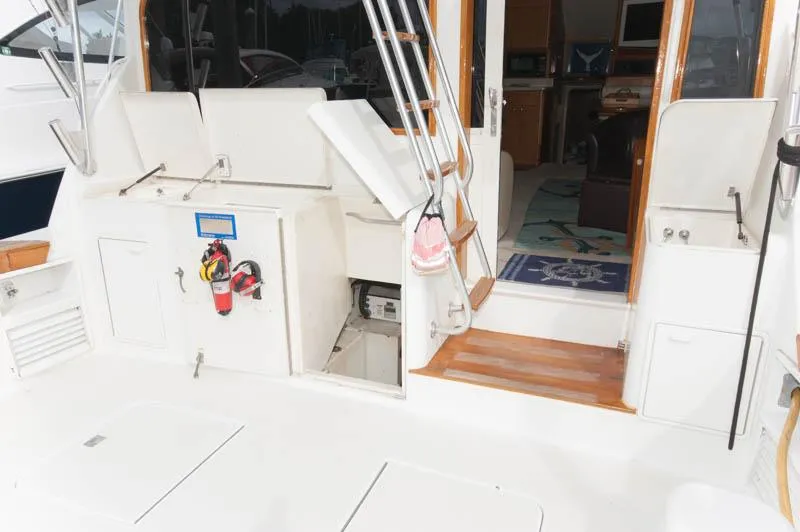 Slide: The Image of 1997 Ocean Yachts 53 Super Sport yacht deck with open hatch and interior view. - 27