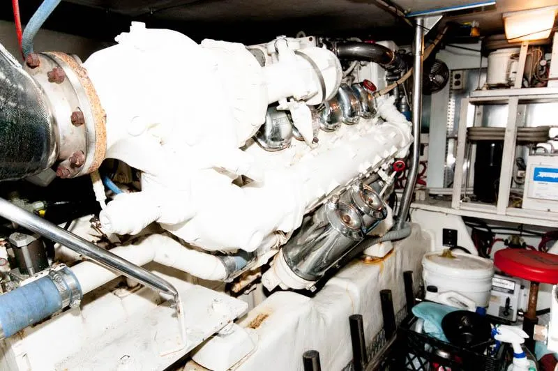 Slide: The Image of Engine room of 1997 Ocean Yachts 53 Super Sport, showcasing mechanical components and equipment. - 31