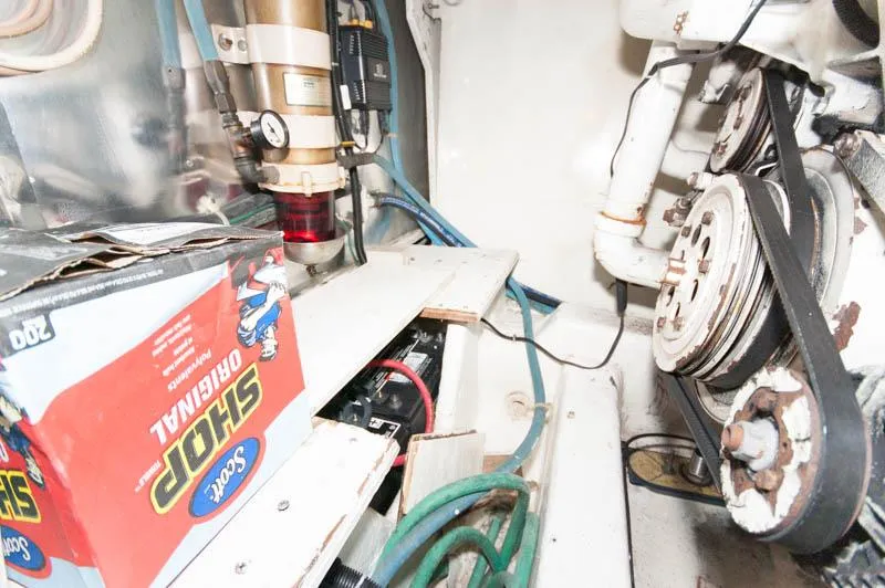 Slide: The Image of Engine room of 1997 Ocean Yachts 53 Super Sport with mechanical components and tools. - 35