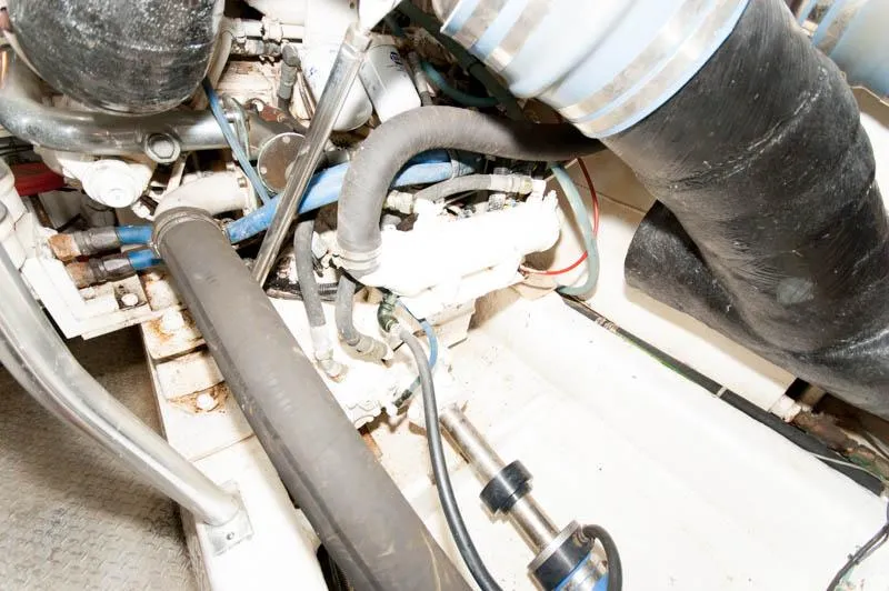 Slide: The Image of Engine compartment of a 1997 Ocean Yachts 53 Super Sport, showcasing mechanical components. - 36