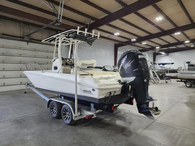 Slide: The Image of 2015 Boston Whaler 240 Dauntless boat on trailer in indoor storage facility. - 2
