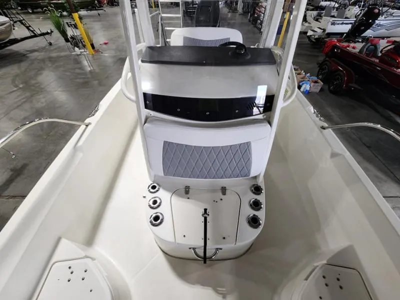 Slide: The Image of 2015 Boston Whaler 240 Dauntless boat interior, featuring console and seating area. - 8