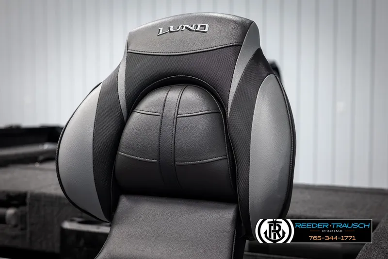 Slide: The Image of 2025 Lund Adventure SS boat seat, black and gray design, Reeder-Trausch Marine logo visible. - 23