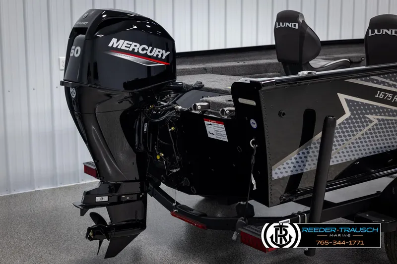 Slide: The Image of 2025 Lund Adventure SS boat with Mercury 60 outboard motor, showcased at Reeder-Trausch Marine. - 33