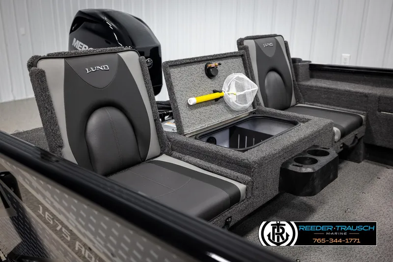Slide: The Image of 2025 Lund Adventure SS boat interior with storage compartment and seating. - 12