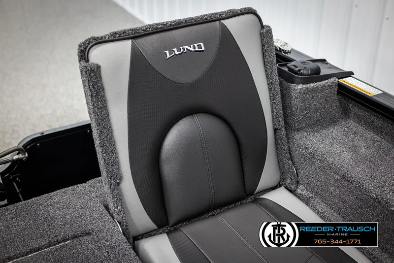 Slide: The Image of 2025 Lund Adventure SS boat seat with gray and black upholstery, Reeder-Trausch Marine logo visible. - 24