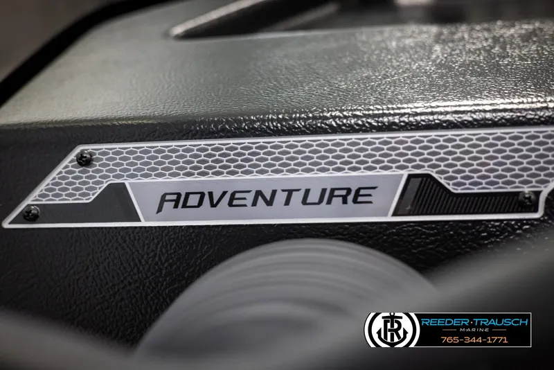 Slide: The Image of 2025 Lund Adventure SS boat dashboard with logo and textured design. - 26