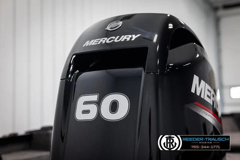 Slide: The Image of 2025 Lund Adventure SS with Mercury 60 horsepower outboard motor in a showroom. - 35