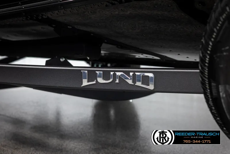 Slide: The Image of 2025 Lund Adventure SS boat trailer with logo, displayed at Reeder-Trausch Marine. - 37