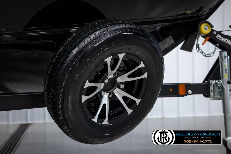 Slide: The Image of 2025 Lund Adventure SS trailer wheel with sleek black and silver design. - 38