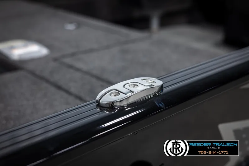 Slide: The Image of 2025 Lund Adventure SS boat detail with sleek chrome hardware, Reeder-Trausch Marine branding. - 41