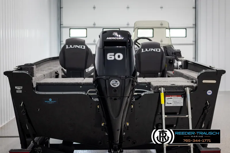 Slide: The Image of 2025 Lund Adventure SS boat with Mercury 60 engine in a showroom. - 5