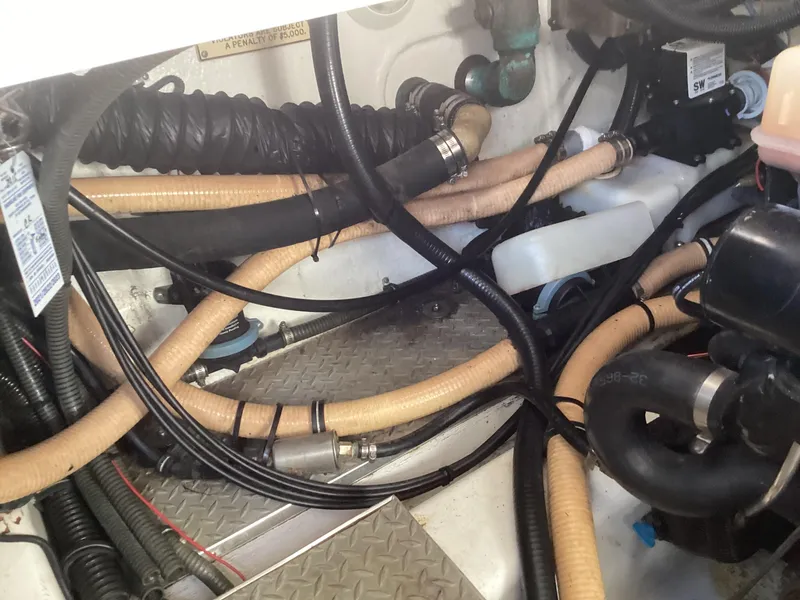 Slide: The Image of Engine compartment of 2001 Formula 370 Super Sport with hoses and wiring. - 11