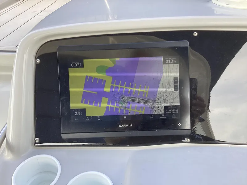 Slide: The Image of Garmin navigation display on 2001 Formula 370 Super Sport boat dashboard. - 14