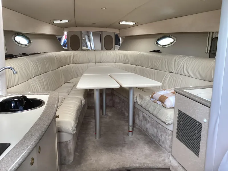 Slide: The Image of Interior of 2001 Formula 370 Super Sport boat with plush seating and table. - 15