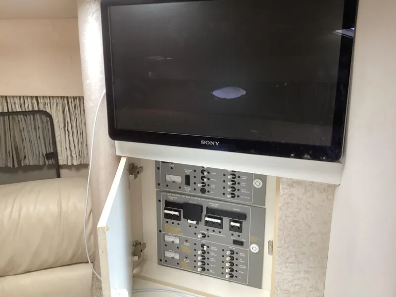 Slide: The Image of Control panel and Sony TV inside 2001 Formula 370 Super Sport boat. - 18