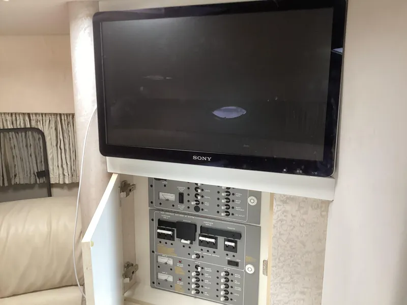 Slide: The Image of Sony TV and control panel inside 2001 Formula 370 Super Sport boat. - 19