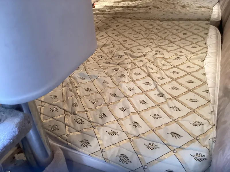 Slide: The Image of Interior cabin of 2001 Formula 370 Super Sport with patterned bedding. - 23