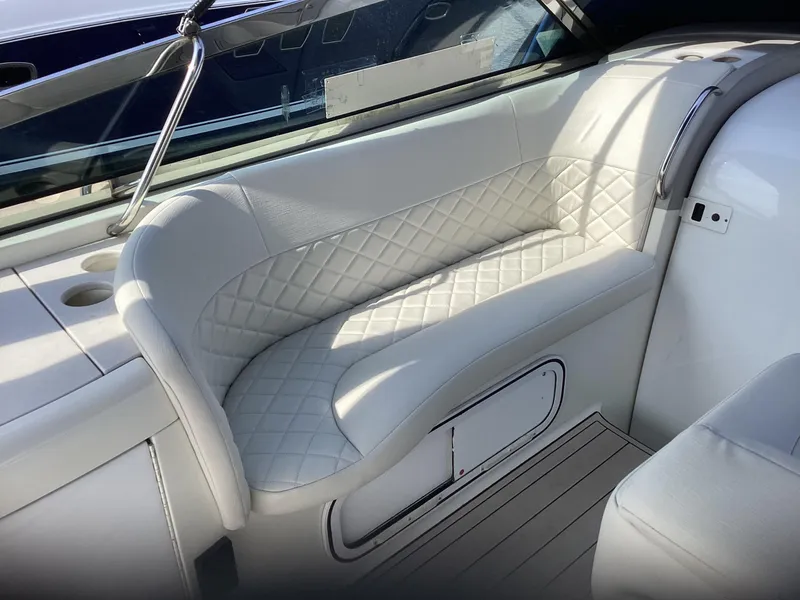 Slide: The Image of Luxurious white seating on 2001 Formula 370 Super Sport boat interior. - 4