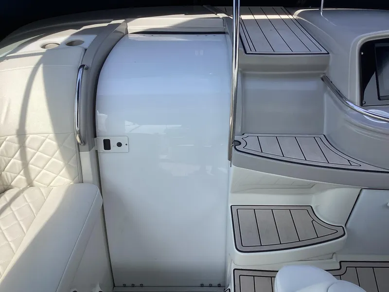 Slide: The Image of Interior of 2001 Formula 370 Super Sport boat with white seating and steps. - 5