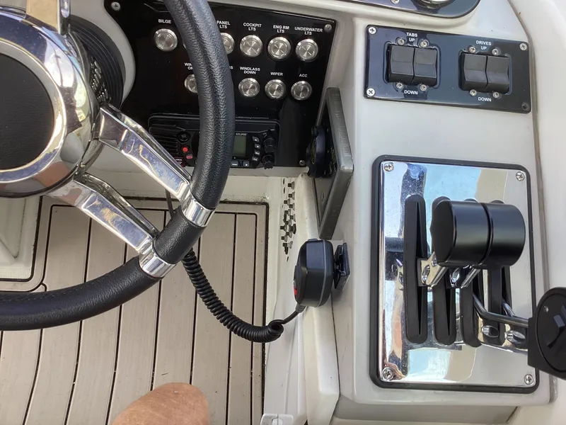 Slide: The Image of 2001 Formula 370 Super Sport boat cockpit with steering wheel and control panel. - 6