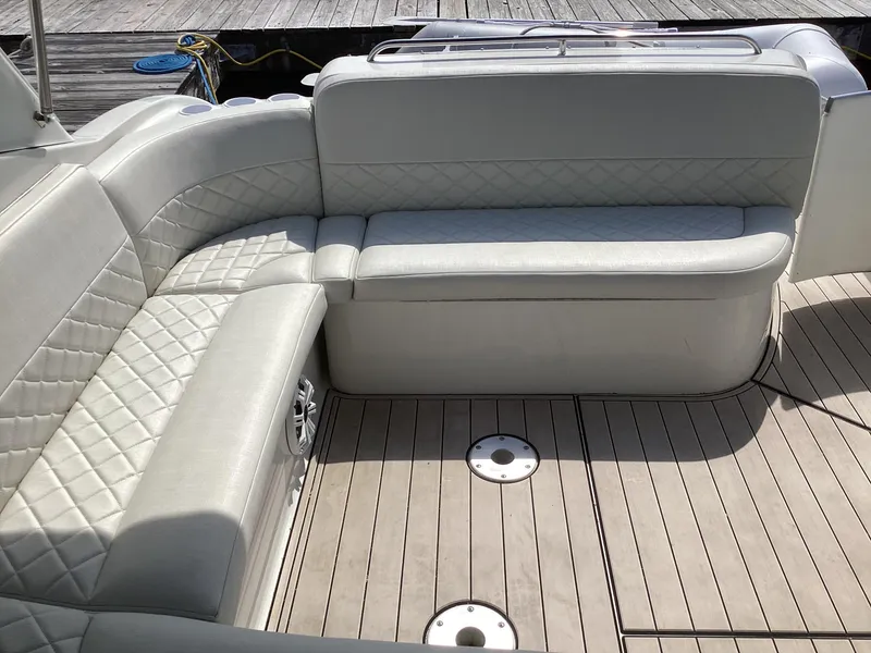 Slide: The Image of 2001 Formula 370 Super Sport boat interior with cushioned seating and teak flooring. - 9