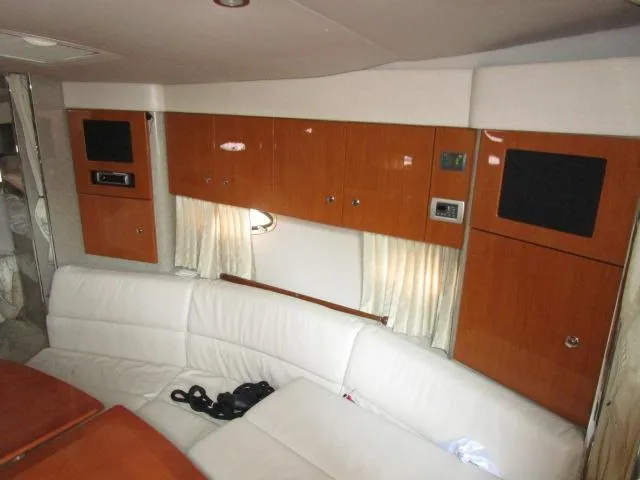 Slide: The Image of Interior of 2006 Formula 34 PC yacht with white seating and wooden cabinets. - 12