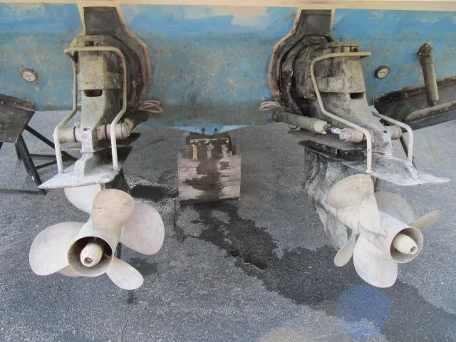 Slide: The Image of 2006 Formula 34 PC boat propellers and stern drives on dry dock. - 19