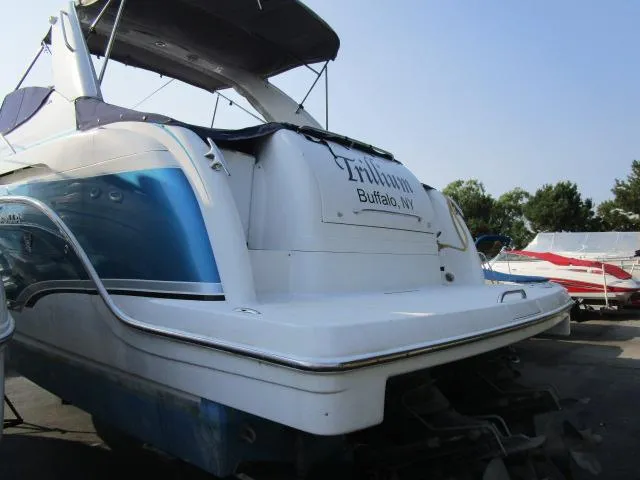 Slide: The Image of 2006 Formula 34 PC boat docked in Buffalo, NY, with blue and white exterior. - 4