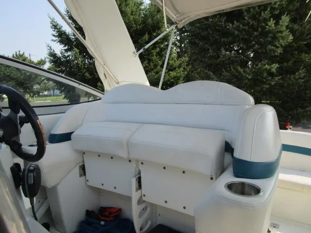 Slide: The Image of 2006 Formula 34 PC boat interior with white seating and cup holder. - 5
