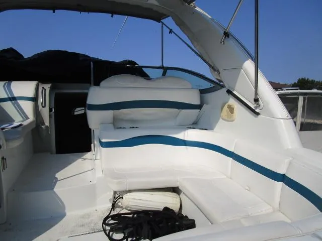Slide: The Image of 2006 Formula 34 PC boat interior with white and blue seating. - 9