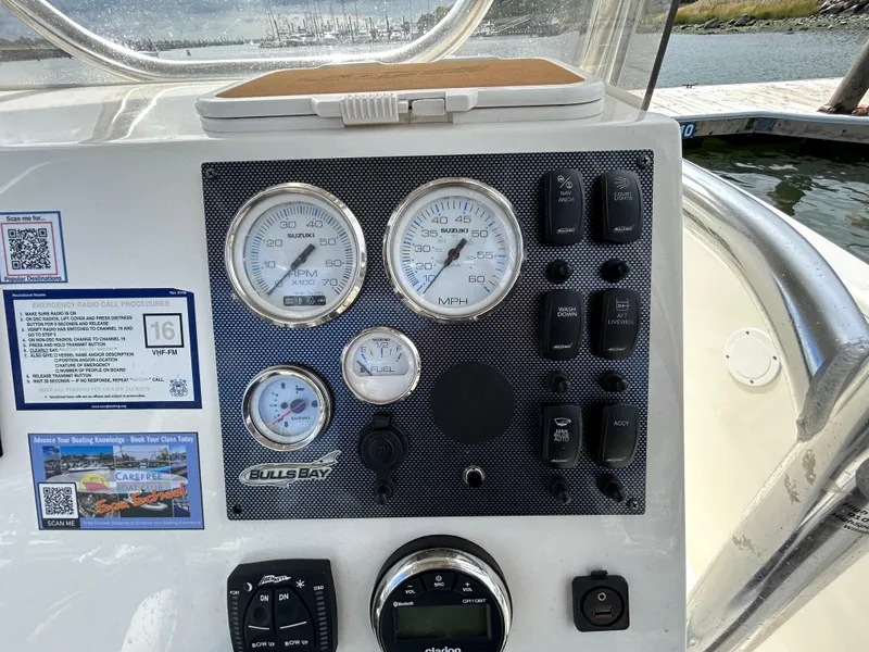 Slide: The Image of Dashboard of 2021 Bulls Bay 230 Center Console boat with gauges and controls. - 10