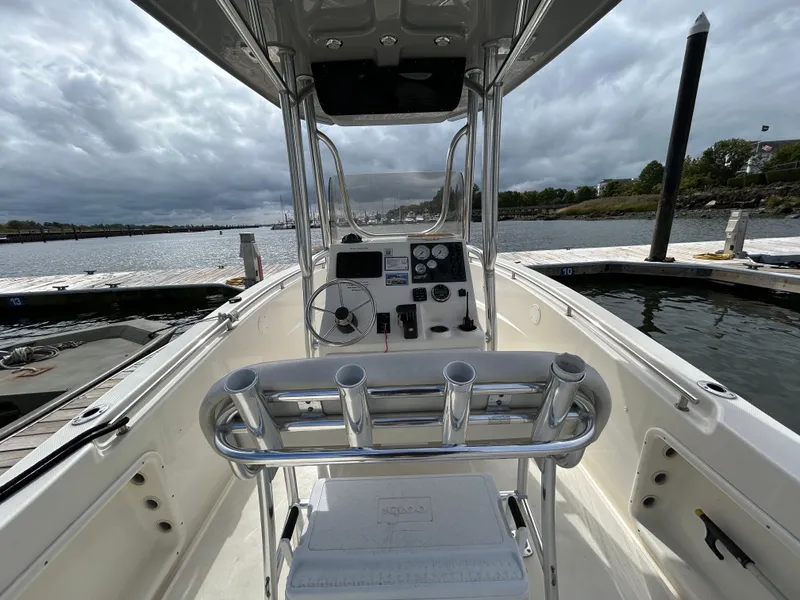 Slide: The Image of 2021 Bulls Bay 230 Center Console boat at dock, overcast sky. - 14