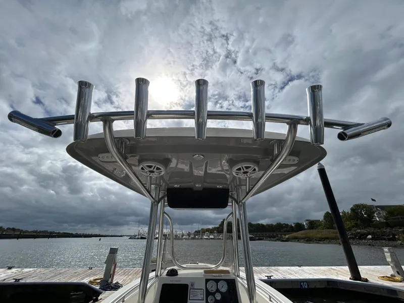 Slide: The Image of 2021 Bulls Bay 230 Center Console boat docked under cloudy sky. - 15