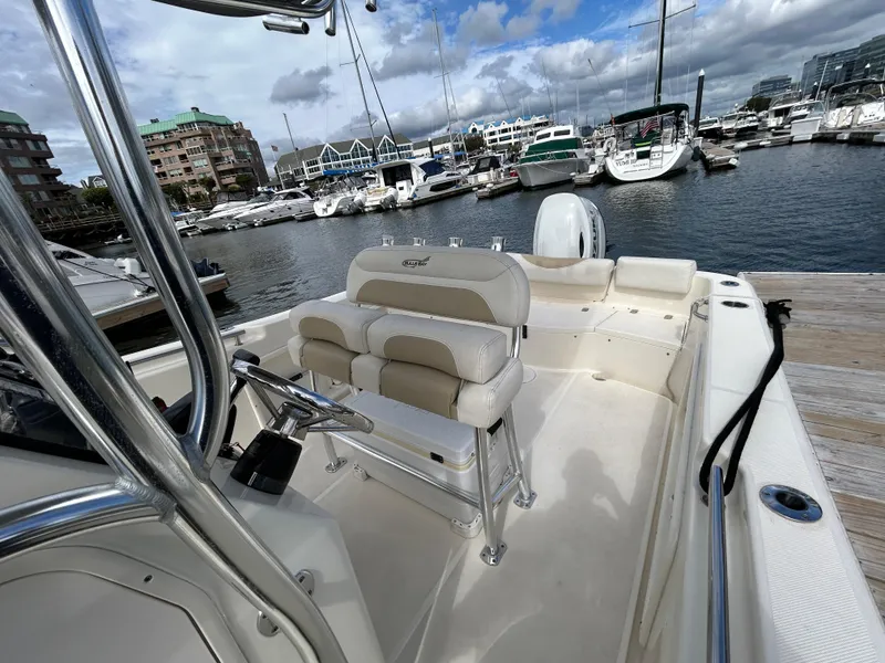 Slide: The Image of 2021 Bulls Bay 230 Center Console boat docked at marina with clear skies. - 19