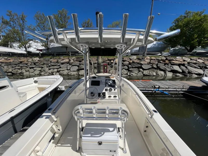 Slide: The Image of 2021 Bulls Bay 230 Center Console boat docked, featuring sleek design and modern controls. - 25