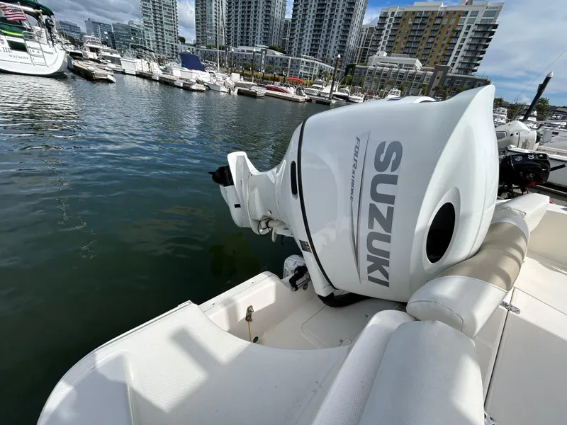Slide: The Image of Bulls Bay 230 Center Console boat with Suzuki engine docked in marina, 2021 model. - 7