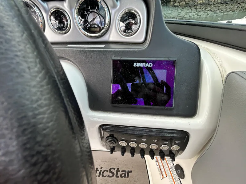 Slide: The Image of Dashboard of 2021 NauticStar 243 DC boat with Simrad display and gauges. - 14