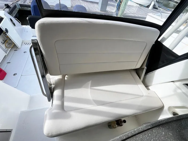 Slide: The Image of 2017 Boston Whaler 345 Conquest interior seating, white leather, modern design. - 17