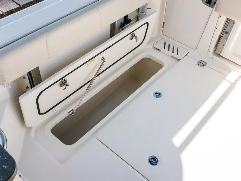 Slide: The Image of Boston Whaler 345 Conquest 2017 boat storage compartment, open and spacious design. - 18