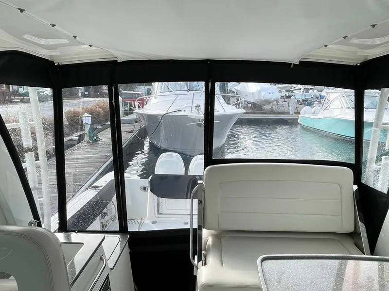 Slide: The Image of Interior view of 2017 Boston Whaler 345 Conquest, docked at marina. - 19