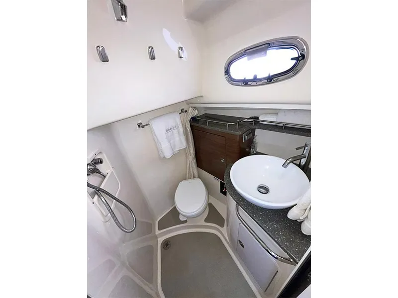 Slide: The Image of 2017 Boston Whaler 345 Conquest bathroom with modern fixtures and compact design. - 24